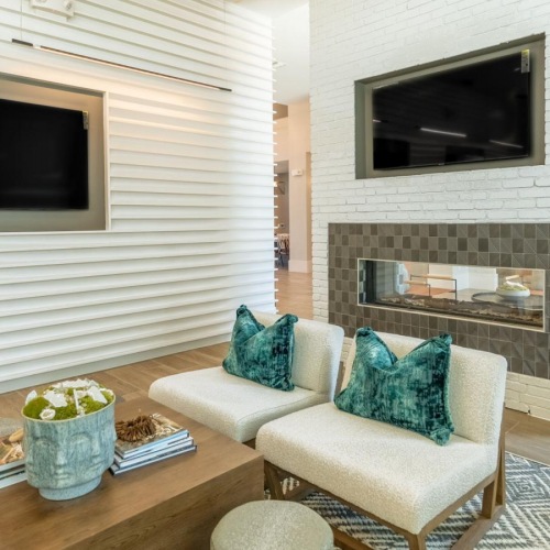 Enjoy our resident-only features Shared clubhouse space with TV at The Chloe Leander apartments in Leander, TX.