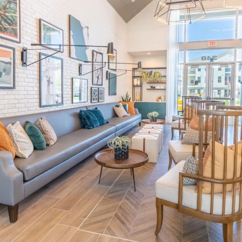 Enjoy our resident-only features a living room with a couch and chairs